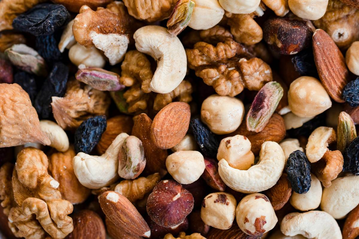 Bar chart showing snack debris levels: store-bought trail mix (high), homemade roasted almonds (low), gummy bears (catastrophic)