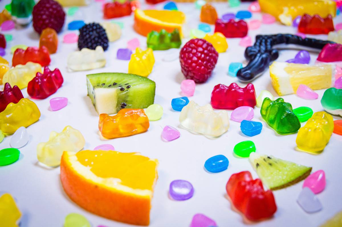 Homemade tasty energy snacks arranged on gaming desk with RGB lighting